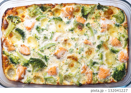 Top view of salmon and broccoli casserole with melted cheese Top view of salmon and broccoli casserole with melted cheese 132041227