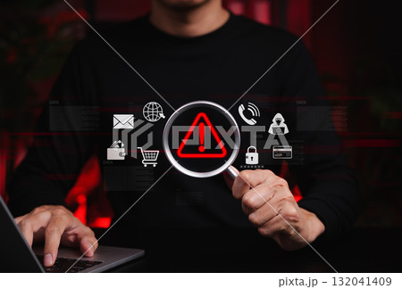 Online Scam Alert and Fraud Detection Concept. Person holds magnifying glass focusing on red warning symbol, online scam detection, cyber fraud risk, scammer, suspicious threat, data security concerns Online Scam Alert and Fraud Detection Concept. Person holds magnifying glass focusing on red warning symbol, online scam detection, cyber fraud risk, scammer, suspicious threat, data security concerns 132041409