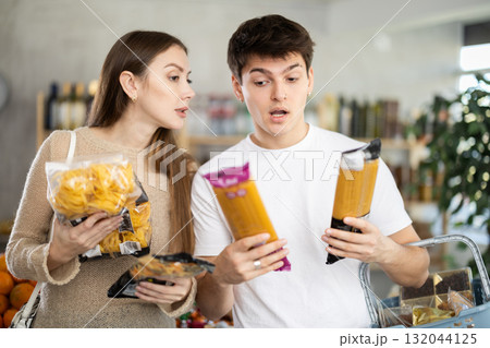 Couple young man and woman choosing pasta 132044125