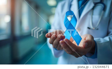 A doctor presents a blue ribbon, representing Movember and emphasizing the importance of men's health and mental well-being A doctor presents a blue ribbon, representing Movember and emphasizing the importance of men's health and mental well-being 132044671