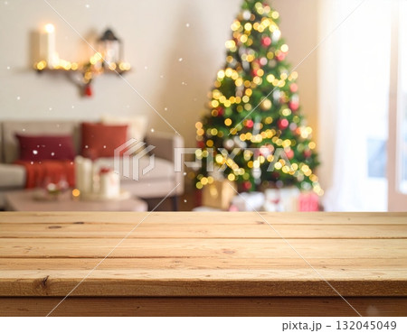 Empty room interior with a Christmas tree on a wooden floor near a blank wall Empty room interior with a Christmas tree on a wooden floor near a blank wall 132045049