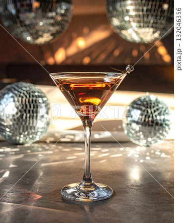 Champagne and martini glasses filled with white and red wine and other drinks sit on a restaurant table, ready for a party celebration dinner 132046356