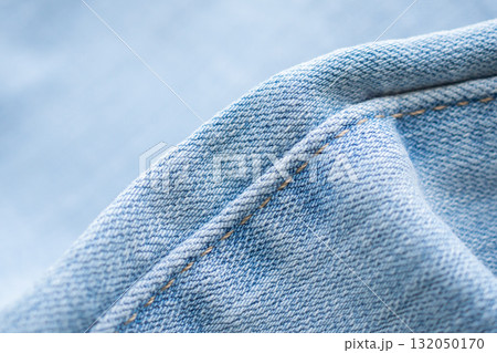 Old denim blue jeans fabric texture background close up Old denim blue jeans fabric texture background close up 132050170