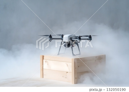 Drone Soaring Above Wooden Crate Surrounded by Thick White Smoke in Studio Setting 132050190