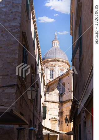 Dubrovnik cathedral dome rising above narrow old town street Dubrovnik cathedral dome rising above narrow old town street 132050685
