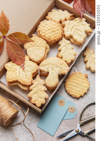 Autumn shaped cookies baking in cardboard gift box Autumn shaped cookies baking in cardboard gift box 132052031
