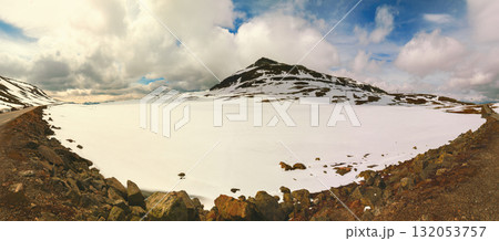 Panoramic view of a highland frozen lake. Nature park in Sauda municipality. Beautiful nature of Norway Panoramic view of a highland frozen lake. Nature park in Sauda municipality. Beautiful nature of Norway 132053757