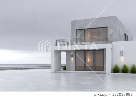 Modern beachfront house with large windows and minimalist design overlooking the ocean at dusk Modern beachfront house with large windows and minimalist design overlooking the ocean at dusk 132053998