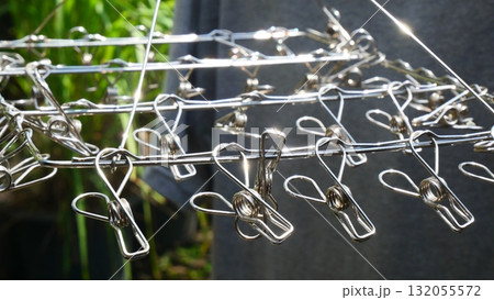 close up of Stainless Steel Clothes Hanger with Clips 132055572