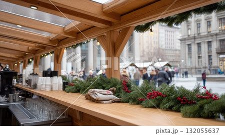 Snow falls gently on the street lined with charming booths adorned with seasonal decorations, creating a festive winter wonderland 132055637