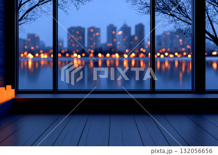Evening city skyline viewed from a modern room with glowing lights reflecting on the water 132056656