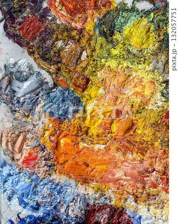 Vibrant textured oil paint palette in warm and cool colors. Creative mess of artist tools. Vibrant textured oil paint palette in warm and cool colors. Creative mess of artist tools. 132057751