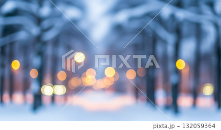 Abstract winter background with blurred snowy park alley and golden bokeh lights, dreamy christmas holiday scene for festive card or banner Abstract winter background with blurred snowy park alley and golden bokeh lights, dreamy christmas holiday scene for festive card or banner 132059364