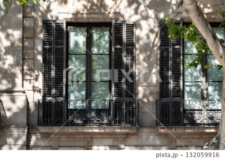 Two balconies against a wall. 132059916