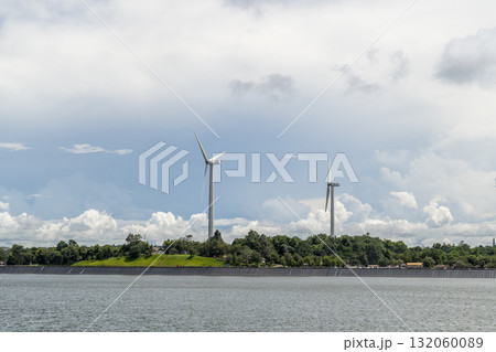 Renewable Wind Energy Turbines on Lush Green Mountain Landscape in Asia Renewable Wind Energy Turbines on Lush Green Mountain Landscape in Asia 132060089