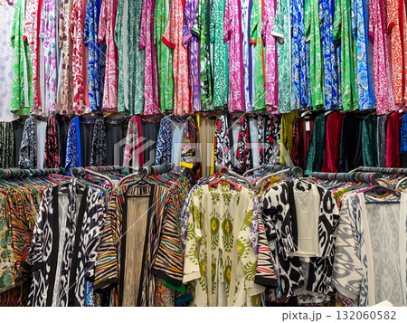Colorful Patterned Garments on Display Racks Colorful Patterned Garments on Display Racks 132060582
