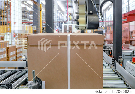 logistic warehouse. packing line in a logistics warehouse. conveyor belt in a modern production line logistic warehouse. packing line in a logistics warehouse. conveyor belt in a modern production line 132060826