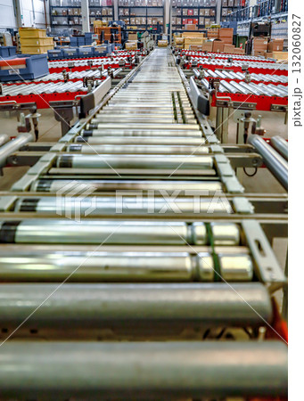 logistic warehouse. packing line in a logistics warehouse. conveyor belt in a modern production line logistic warehouse. packing line in a logistics warehouse. conveyor belt in a modern production line 132060827