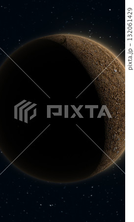 Space scene showing a rocky planet partially in shadow with glowing edges against a starry night sky 132061429