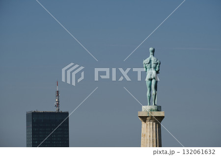 Close-up of Pobednik monument in Kalemegdan Fortress, Belgrade with city tower in background Close-up of Pobednik monument in Kalemegdan Fortress, Belgrade with city tower in background 132061632