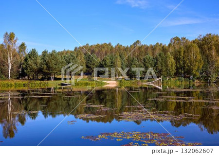 Tranquil River Reflections of Autumn Trees Tranquil River Reflections of Autumn Trees 132062607