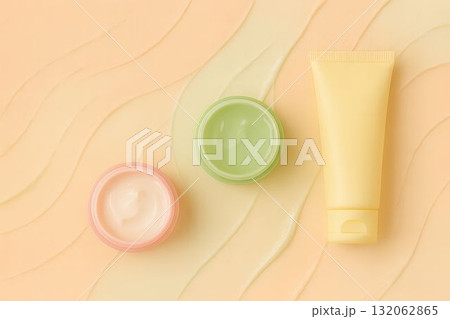 Colorful skincare products arranged on a textured background with soft waves and gradients 132062865