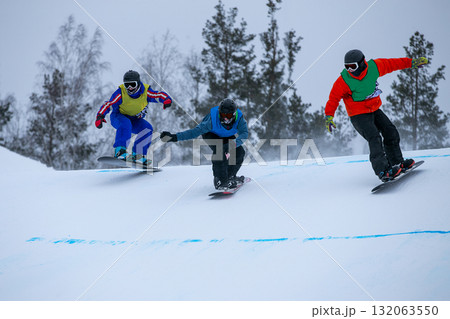 Group snowboarders in competition race snowboard cross Group snowboarders in competition race snowboard cross 132063550