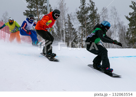 Four snowboarders in competition snowboard cross Four snowboarders in competition snowboard cross 132063554