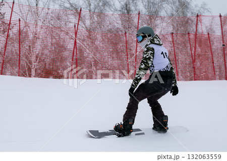 Male snowboarder in competition snowboard cross Male snowboarder in competition snowboard cross 132063559