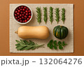 Cranberries squash rosemary sage parsley on linen cloth flat lay composition for autumn harvest cooking concept. 132064276