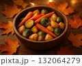 Roasted carrots potatoes and brussels sprouts in wooden bowl with autumn maple leaves on rustic table. 132064279