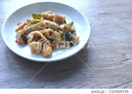 spicy stir fried slice bamboo shoot and fish ball with curry on plate  132066546