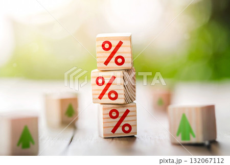 Interest rate financial and mortgage rates concept. Wooden cube block with interest rate and up arrow. Interest rate financial and mortgage rates concept. Wooden cube block with interest rate and up arrow. 132067112