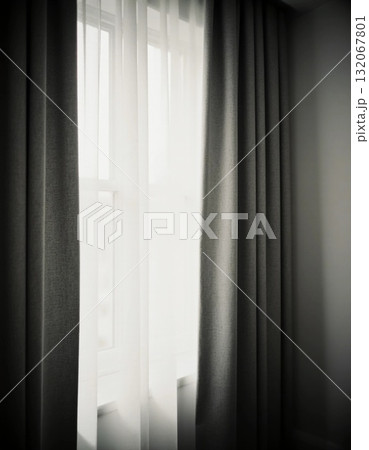 Black curtains drape gracefully around a bright window, allowing gentle light to filter through. The contrast creates a calming vibe in the room, perfect for relaxation Generative AI Black curtains drape gracefully around a bright window, allowing gentle light to filter through. The contrast creates a calming vibe in the room, perfect for relaxation Generative AI 132067801