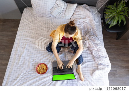 Woman Shops Online on Laptop During Black Friday From the Comfort of Home Woman Shops Online on Laptop During Black Friday From the Comfort of Home 132068017
