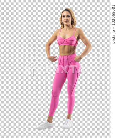 Athletic woman smiling, posing in pink fitness outfiton on transparent background 132068081
