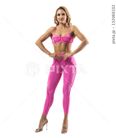 Athletic woman smiling, posing in pink fitness outfiton on transparent background Athletic woman smiling, posing in pink fitness outfiton on transparent background 132068102