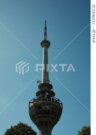 Ruined TV tower Iriski Venac on Fruska Gora, destroyed by NATO missile during the Yugoslav war, standing above forest trees 132068318