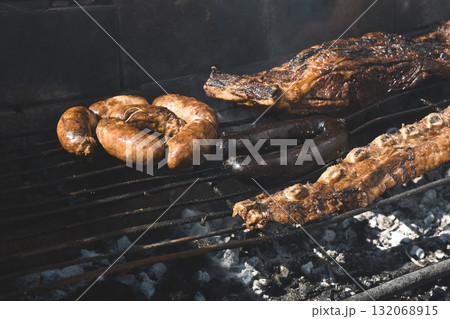 Barbecue, grilled sausages and cow meat , traditional argentine cuisine 132068915