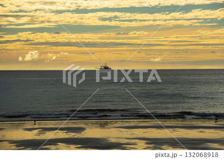 Ship in marine landscape at evening, Patagonia, Argentina. 132068918