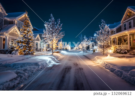Snowy Christmas street glows with bright lights on houses and trees. Snowy Christmas street glows with bright lights on houses and trees. 132069612
