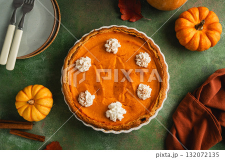 Pumpkin pie, Thanksgiving homemade crust tart, topped with whipped cream Pumpkin pie, Thanksgiving homemade crust tart, topped with whipped cream 132072135