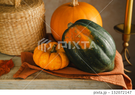 Orange pumpkins, rustic wooden moody background, autumn concept 132072147