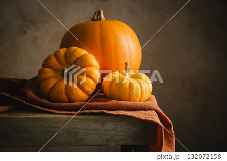 Orange pumpkins, rustic wooden moody background, autumn concept 132072158