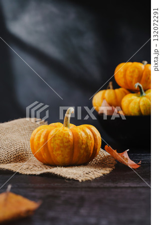 Orange pumpkins on dark background, abstract autumn, concept, copy space 132072291