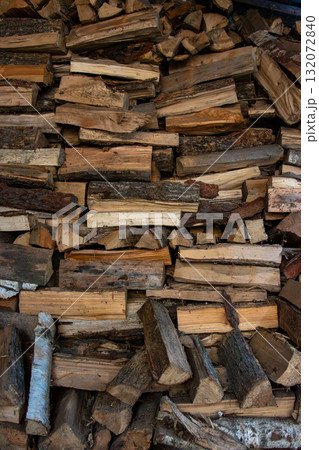 Large wood pile of chopped logs, natural wooden texture background Large wood pile of chopped logs, natural wooden texture background 132072840