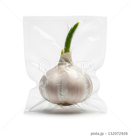 Garlic bulb with green sprout in transparent packaging at a market stall ready for culinary use and fresh cooking 132072926