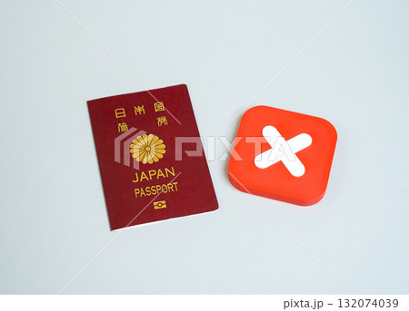 Japanese passport and refusal cross. Ban on entry or exit. Refusal to obtain a passport or citizenship. Ban on entry of citizens into the country of arrival. Japanese passport and refusal cross. Ban on entry or exit. Refusal to obtain a passport or citizenship. Ban on entry of citizens into the country of arrival. 132074039