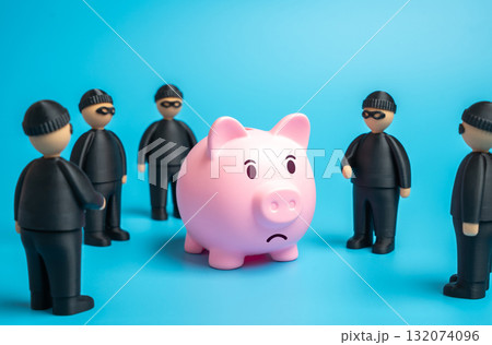 Robbers want to steal savings. Savings are at risk. Symbol of financial threat, fraud, and data theft. Banking, insurance, and cybersecurity Robbers want to steal savings. Savings are at risk. Symbol of financial threat, fraud, and data theft. Banking, insurance, and cybersecurity 132074096