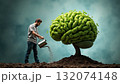 Man watering a brain-shaped tree in a surreal landscape with a cloudy background during daylight 132074148